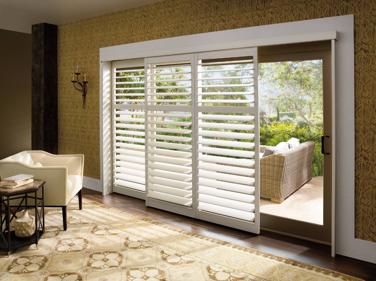 An open living room with large windows and Hunter Douglas Palm Beach™ Polysatin® Shutters near Scottsdale, AZ