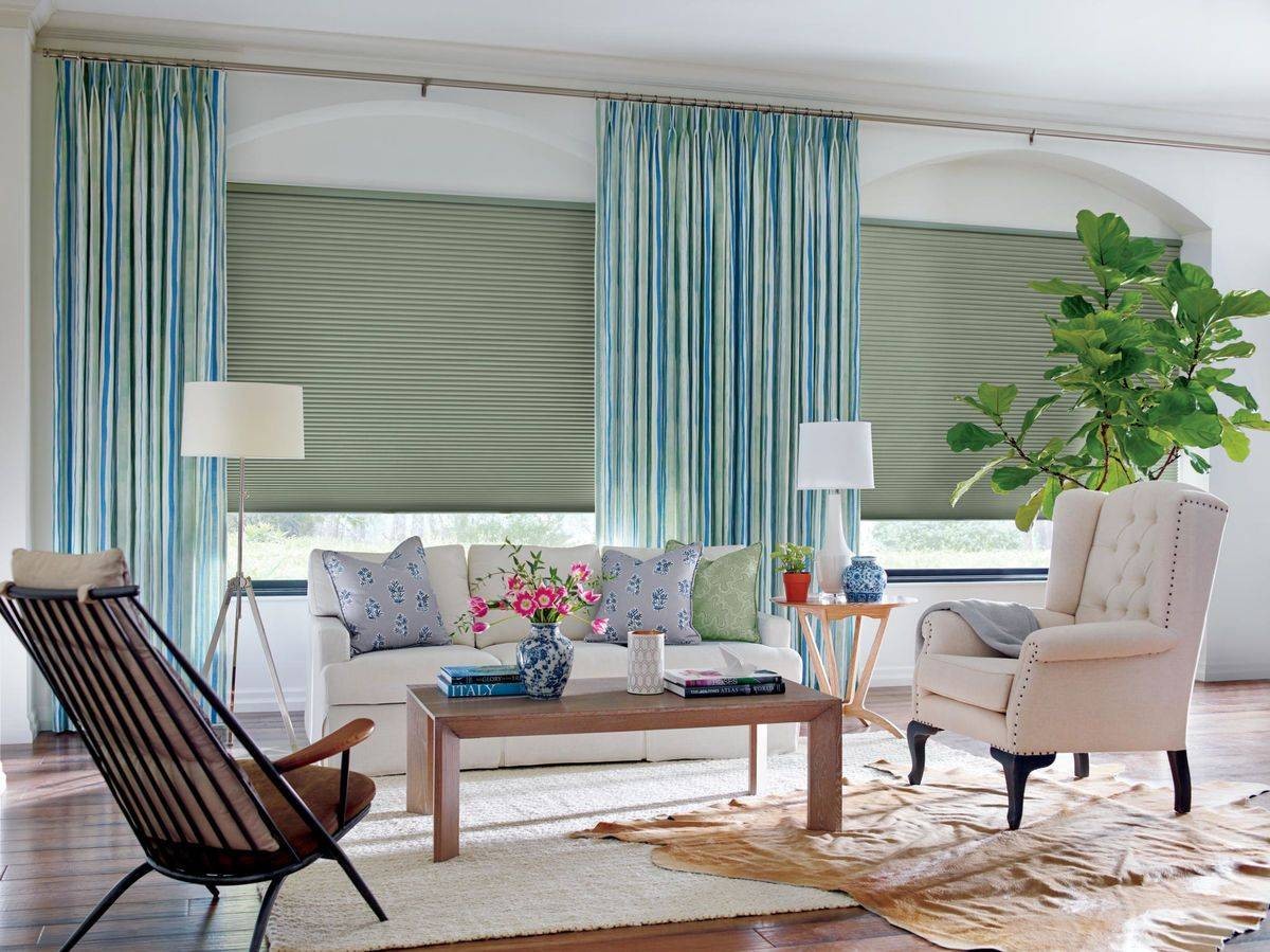 small living room with several windows outfitted with Hunter Douglas Duette® Cellular Shades near Scottsdale, AZ